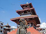 Kathmandu Durbar Square 03 03 Garuda Statue And Maju Deval Narayan Temple Garuda kneels with his hands in the namaste position in Kathmandu Durbar Square with the nine-step Maju Deval Narayan Temple to the north.